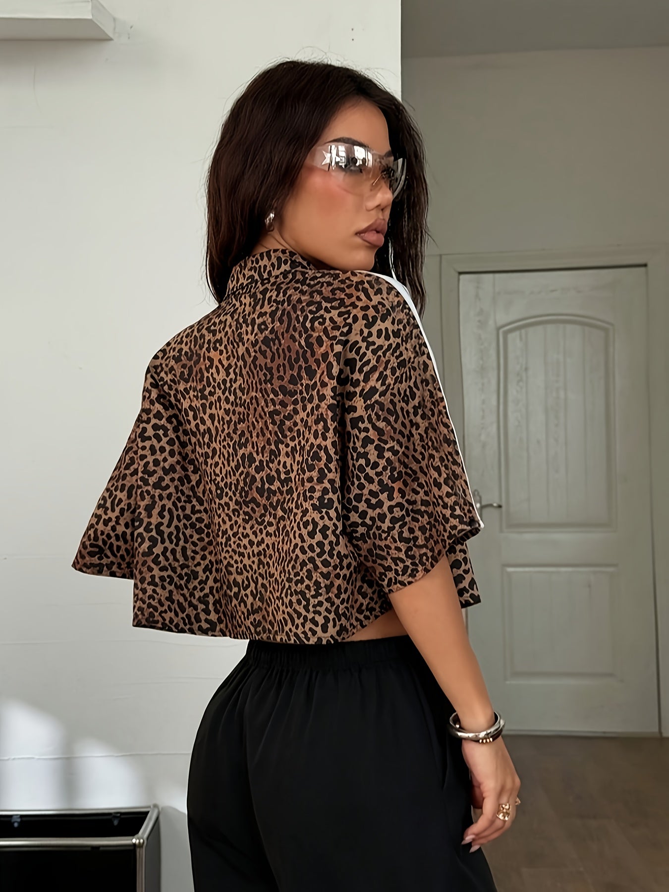 Women'S Y2K Leopard Print Crop Top with Button Details - Black & Brown Animal Print Shirt, White Cropped Tank, Black Pants, Red Headband, Layered Necklaces, and Accessories, Casual Chic Outfit, Casual Chic Outfit | Y2K Fashion | Button Detail Shirt